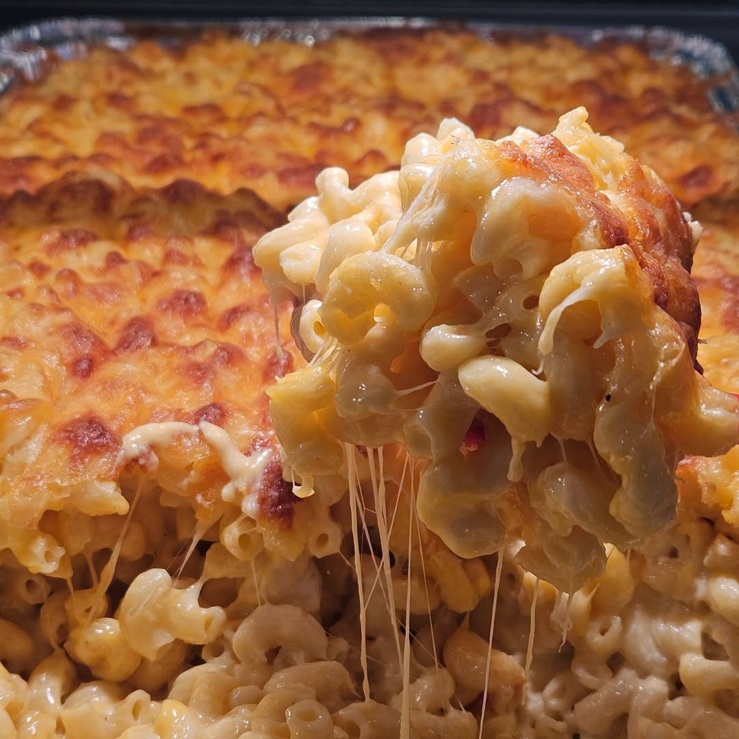 Baked mac and cheese with a cheese pull at Baker's BBQ